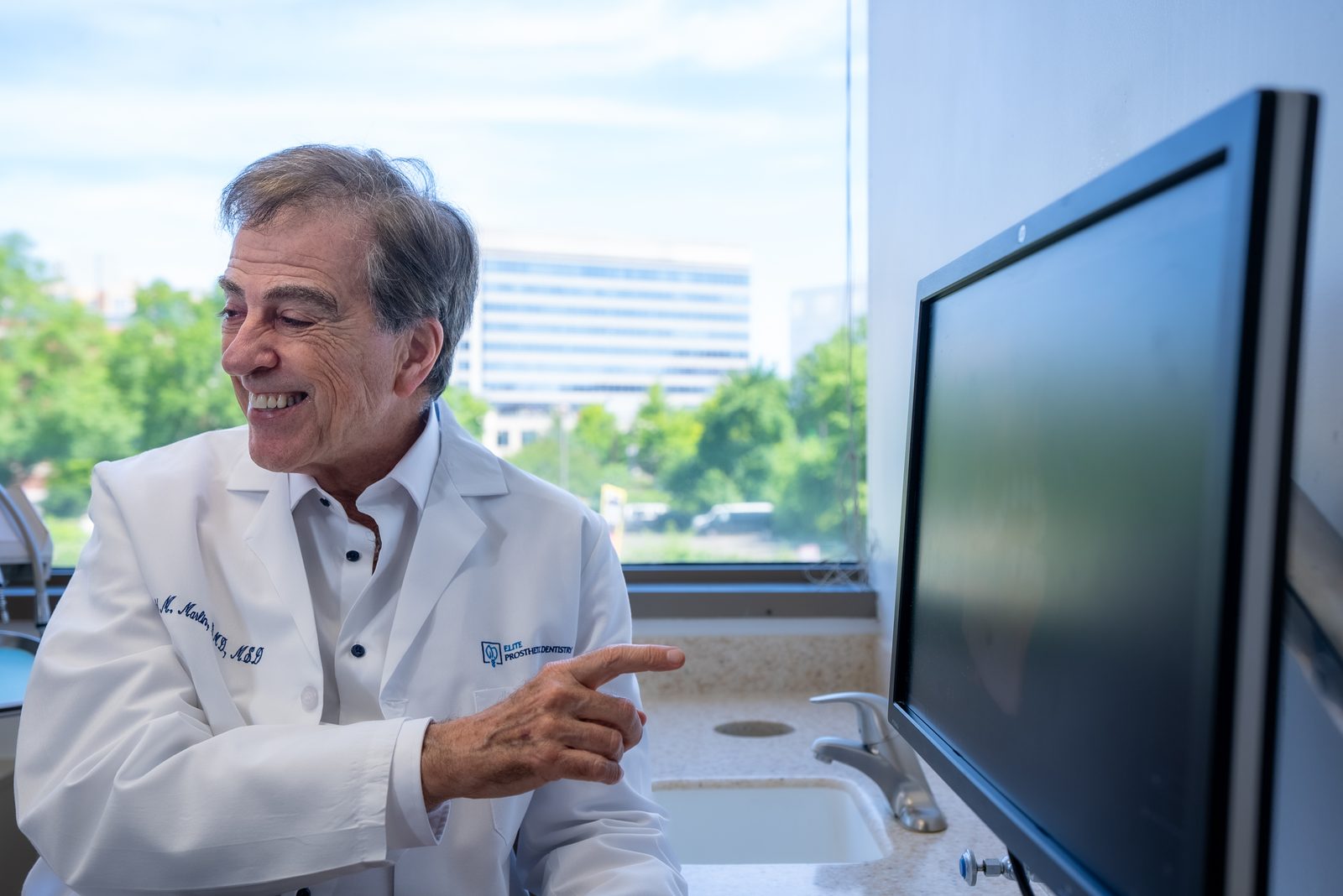 Follow-up dental implant care for senior patient at Elite Prosthetic Dentistry serving Bethesda area