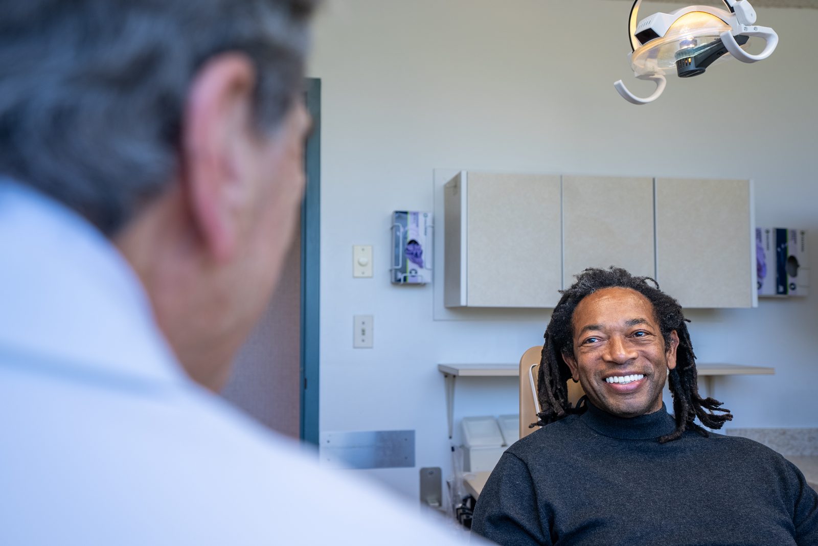 Patient receiving comfortable dental implant treatment with modern pain management at Elite Prosthetic Dentistry